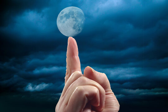 finger indicates the moon woman's hand with index finger points and sebra to support the moon