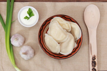 bowl with dumplings close-up on a wooden table