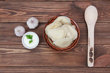 
ready-made dumplings in a plate close-up on the table