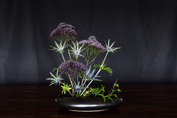 Ikebana , Japanese flower arrangement, simply putting flowers in a container. 
