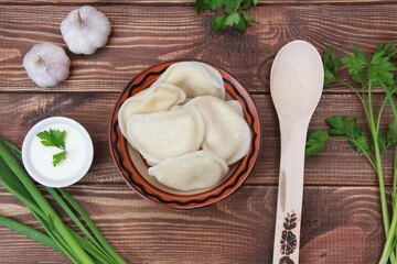 
ready-made dumplings in a plate close-up on the table