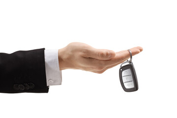 Male hand holding a car key with a key ring