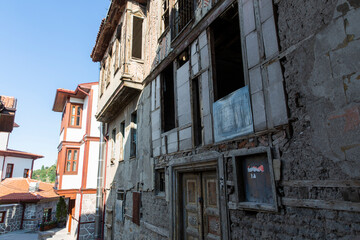 Fototapeta na wymiar Ulus, Ankara, Turkey - September 01 2016: Ankara's historical district, Ulus Hacibayram neighborhood, old ruins and restored and renovated historical houses on the streets