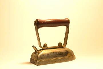 An old antique vintage retro electric iron isolated for ironing clothes 