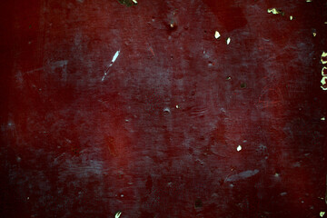 Old dark red rusty metal panel background texture with side vignette in a full frame view. This is...