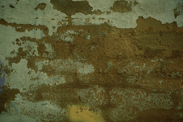 Background texture of grunge weathered plaster on an old wall with flaking white paint in a full frame view. This is a lighter version, a darker version is also available in the portfolio