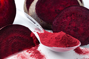 Superfood beetroot powder on a white background. Healthy eating concept dry beet powder.