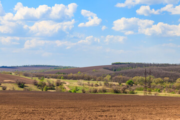 View of the ploughed field at spring. Agricultural landscape