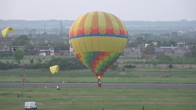 Hot air balloon and paramotors at Chinese airshow