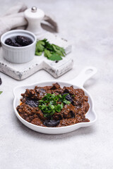 Hot stewed meat with prunes