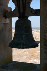 Obraz premium View of Juromenha castle window and bell in Alentejo landscape in Portugal