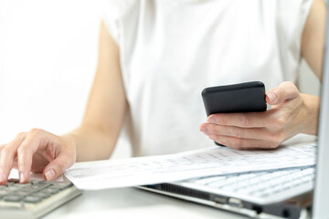 smartphone and receipts in the girl's hand, online payment concept