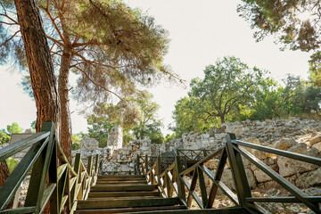 stairs in the park. beautiful view of the ruins of the old town of Phaselis. sunny tourist day.