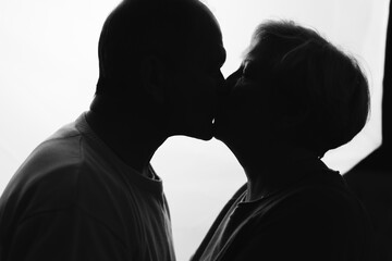 Elderly couple hugging in black and white colors. Happy loving caring people. Caucasian retired man and woman. valentines day