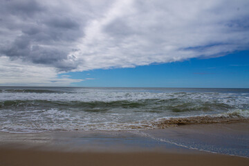 Fototapeta na wymiar blue sky on beach turning gray