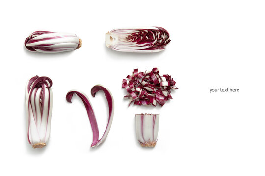 Whole and cut Treviso red radicchio on a white wooden background. Top view layout