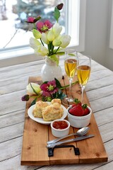 Celebratory Mother's Day brunch for breakfast in bed to honour Mom with gourmet scones and preserves and champagne. 