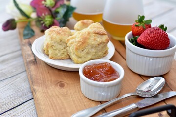 Celebratory Mother's Day brunch for breakfast in bed to honour Mom with gourmet scones and preserves and champagne. 