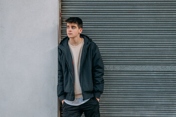 young man on the street looking sideways