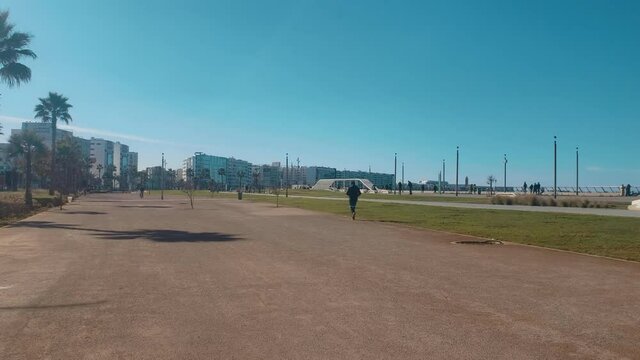 view of a  man jogging in Hassan II Park - Casablanca, Morocco
