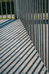 Fence shadows on the sports playground