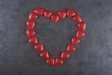 Valentine’s day background with red heart and gray background.