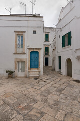 Typical Street Scene Of The Historical Center of Martina Franca, A Village In Puglia, Apulia, Italy On A Cloudy Rainy Day
