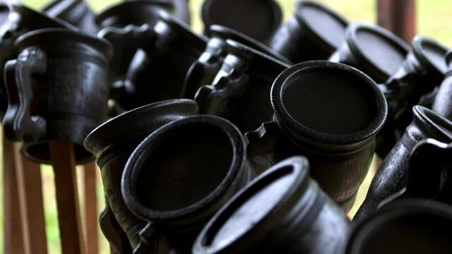 Handcrafted wooden mugs. Close up of handmade wooden cups at workshop. Perfect idea for souvenir.