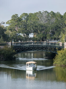 A small boat plies the canal in Palmetto Bluff, an exclusive community in South Carolina