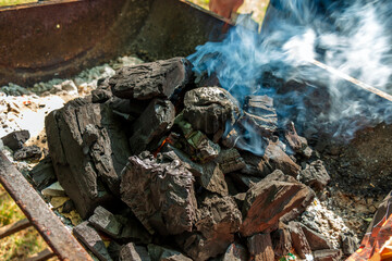 Burnt lumps of charcoal for bbq