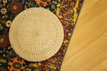 close up weave handicraft asian style on scandinavian carpet on wooden floor.
