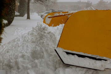 Tractor clears the snow removal vehicle removing snow way after heavy snowfall