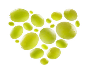 Green grapes in the shape of a heart on a white background