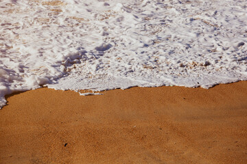 Ocean foam on a beach