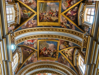 Beautiful interior with paintings and decorations inside of Church in Valletta (or Il-Belt), the capital of the Mediterranean island nation of Malta