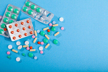 Many colored scattered pills and tablets, supplements for disease, medicines set