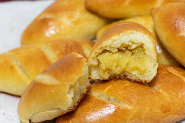 Freshly baked pies. Russian pies - piroshki with potatoes. Pirozhki. Food background