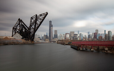 Fototapeta na wymiar Chicago, Illinois, USA: Chicago skyline with St. Charles Air Line Bridge. View from Ping Tom memorial park. Long exposure.