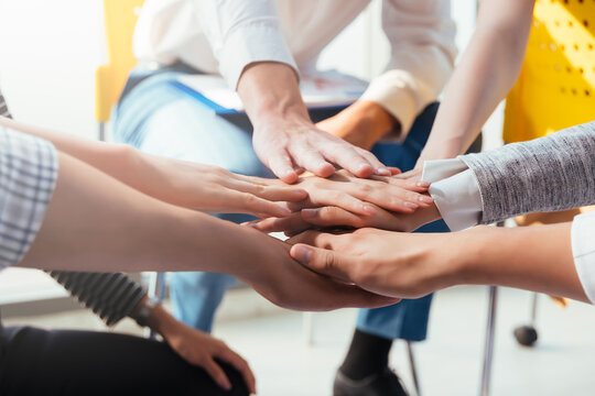 Teamwork business join hand together concept, Business team standing hands together, Volunteer charity work. People joining for cooperation success business.