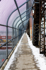 Fence covered walkway over the Arlington Street Bridge in Winnipeg, Manitoba, Canada