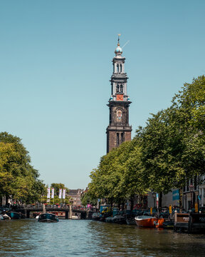 Westerkerk church beside water in Amsterdam