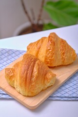Warm Fresh Buttery Croissants and Rolls. French and American Croissants and Baked Pastries are enjoyed.