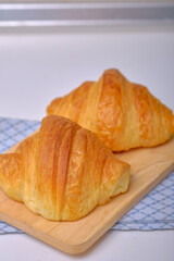 Warm Fresh Buttery Croissants and Rolls. French and American Croissants and Baked Pastries are enjoyed.