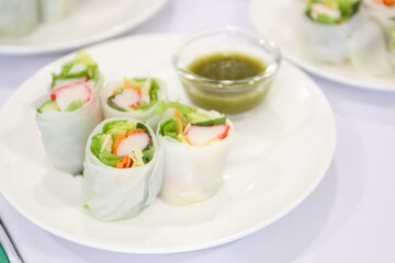 Vermicelli Roll salad with spicy seafood sauce in background