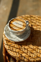  hot latte art coffee on wooden