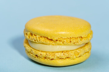 Macaron. Traditional french colorful macarons close up, macro on blue background
