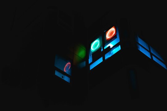 Low-angle photography of building windows emitting lights