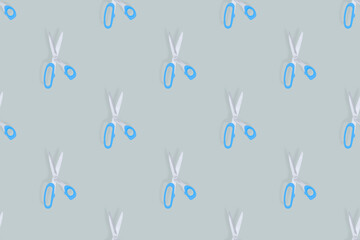 Fototapeta premium Scissors seamless pattern. Barber scissors against gray background backdrop.