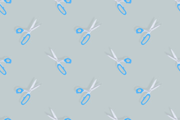 Scissors seamless pattern. Barber scissors against gray background backdrop.