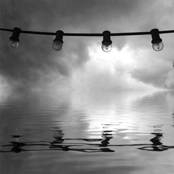 Grayscale photography of light bulbs